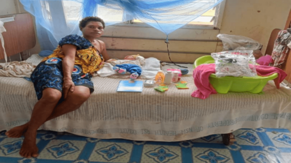 A mother and her newborn and their supply of the baby bundle in Matkomnai Sub-health center, Kiunga, Western Province.