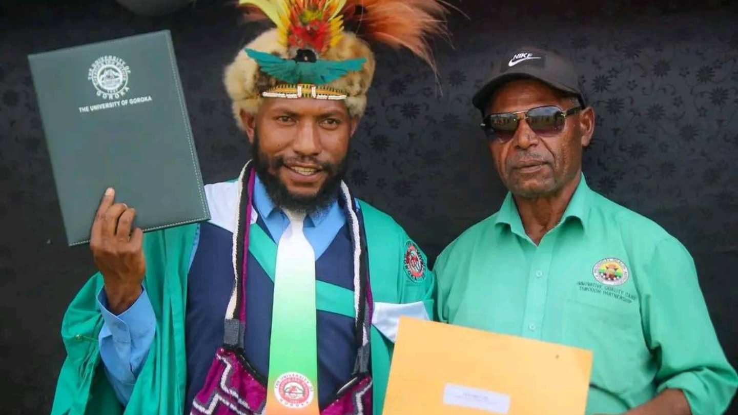 Gilbert Gei holding on to his bachelor's degree alongside the Director of Nursing Services at the Magarima District Hospital, Mr. Joseph Jarali who came to witness his graduation.  Photo Courtesy of Gilbert Gei.