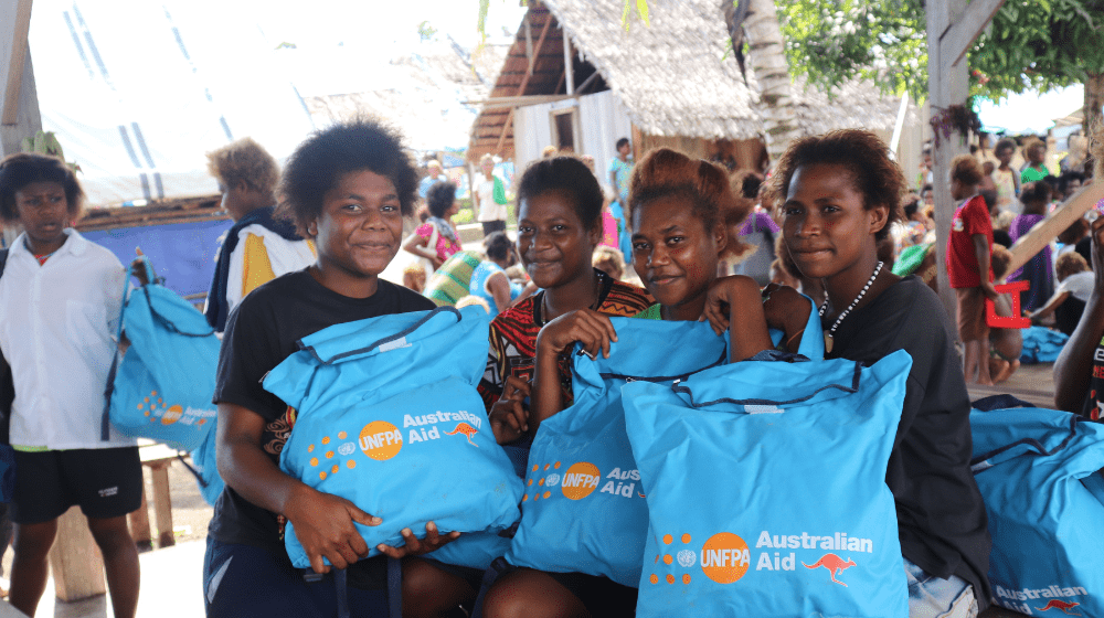 Young girls from the Sovolu CareCenter with their Dignity Kits